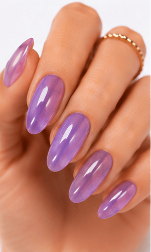 Jelly nails use translucent gel colors to create a juicy, glassy, and slightly playful manicure. The finish looks like tinted candy, fruit syrup, or clear jelly layered over the natural nail. This style is loved because it feels fresh and light while still adding color and shine. Jelly nails can be simple as a sheer one-color set, trendy with syrup gradients, cute with fruit motifs, or luxurious when paired with chrome, pearls, aurora powder, or 3D accents. They are especially useful for summer collections, Korean-inspired nail trends, youthful beauty apps, and clients who want color without a heavy opaque finish.