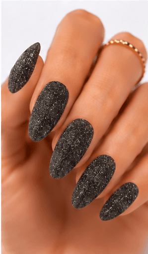 Sugar nails create a fine sparkling texture that looks like crystallized sugar dusted over the nail surface. The effect is usually made with sugar powder, fine glitter, textured gel, or sprinkled particles that stay slightly raised after curing. This style feels cute, festive, and tactile, but it can also look refined when done in white, champagne, or soft pastel tones. Sugar nails are popular for snow themes, holiday designs, dessert-inspired looks, bridal sparkle, and kawaii collections. They work especially well as accent nails, sweater patterns, frosted French tips, or delicate textured details in photo galleries and salon menus.