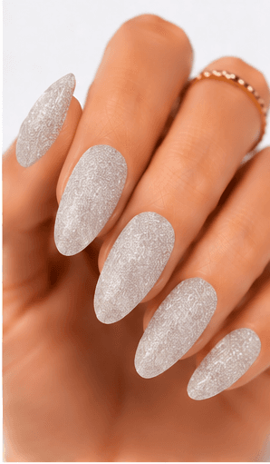 Sugar nails create a fine sparkling texture that looks like crystallized sugar dusted over the nail surface. The effect is usually made with sugar powder, fine glitter, textured gel, or sprinkled particles that stay slightly raised after curing. This style feels cute, festive, and tactile, but it can also look refined when done in white, champagne, or soft pastel tones. Sugar nails are popular for snow themes, holiday designs, dessert-inspired looks, bridal sparkle, and kawaii collections. They work especially well as accent nails, sweater patterns, frosted French tips, or delicate textured details in photo galleries and salon menus.
