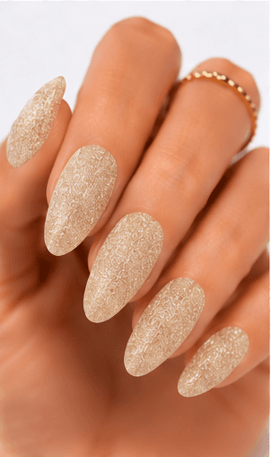 Sugar nails create a fine sparkling texture that looks like crystallized sugar dusted over the nail surface. The effect is usually made with sugar powder, fine glitter, textured gel, or sprinkled particles that stay slightly raised after curing. This style feels cute, festive, and tactile, but it can also look refined when done in white, champagne, or soft pastel tones. Sugar nails are popular for snow themes, holiday designs, dessert-inspired looks, bridal sparkle, and kawaii collections. They work especially well as accent nails, sweater patterns, frosted French tips, or delicate textured details in photo galleries and salon menus.