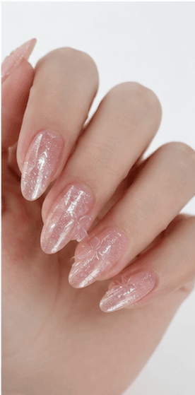 Almond nails are shaped with tapered sides and a softly rounded point, resembling the silhouette of an almond. This shape is loved for its elegant, feminine, and lengthening effect, making the fingers appear slimmer and more refined. Almond nails work best with medium to long nails, either natural or extended, because the tapered form needs enough length to balance the tip. They pair beautifully with French tips, chrome, cat-eye, aura, floral designs, pearls, marble, and bridal styles. Almond is a strong choice for clients who want sophistication, trend appeal, and a flattering hand shape without the sharpness of stiletto nails.