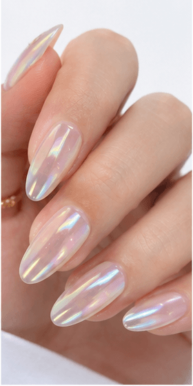 Almond nails are shaped with tapered sides and a softly rounded point, resembling the silhouette of an almond. This shape is loved for its elegant, feminine, and lengthening effect, making the fingers appear slimmer and more refined. Almond nails work best with medium to long nails, either natural or extended, because the tapered form needs enough length to balance the tip. They pair beautifully with French tips, chrome, cat-eye, aura, floral designs, pearls, marble, and bridal styles. Almond is a strong choice for clients who want sophistication, trend appeal, and a flattering hand shape without the sharpness of stiletto nails.
