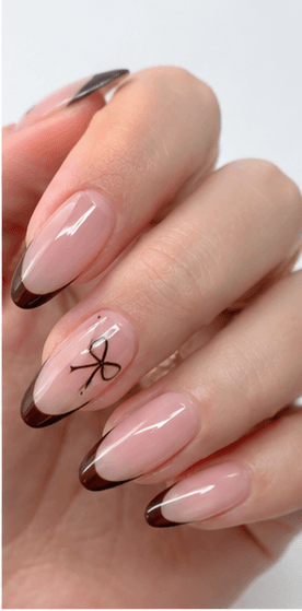 Almond nails are shaped with tapered sides and a softly rounded point, resembling the silhouette of an almond. This shape is loved for its elegant, feminine, and lengthening effect, making the fingers appear slimmer and more refined. Almond nails work best with medium to long nails, either natural or extended, because the tapered form needs enough length to balance the tip. They pair beautifully with French tips, chrome, cat-eye, aura, floral designs, pearls, marble, and bridal styles. Almond is a strong choice for clients who want sophistication, trend appeal, and a flattering hand shape without the sharpness of stiletto nails.