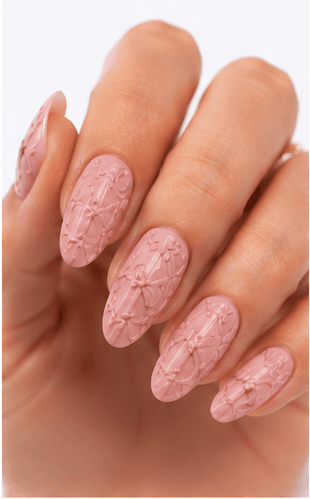Emboss nails create raised patterns that look pressed, carved, or sculpted into the manicure surface. Unlike large 3D charms, emboss designs are usually more integrated with the nail and often appear as raised flowers, lace, shells, knit textures, monograms, ribbons, or ornamental lines. This style feels refined because the texture can be subtle while still adding depth and craftsmanship. White emboss over nude or milky bases looks bridal and elegant, while metallic or dark emboss can feel vintage, gothic, or fashion-forward. It is useful for luxury nail collections, wedding menus, winter knit designs, and close-up beauty photography.