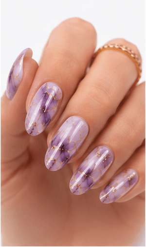 Foil nails use thin metallic or colored foil pieces to add shine, texture, and an irregular luxury effect to the manicure. The foil can be pressed lightly for scattered accents, layered under sheer gel for a soft glow, or placed boldly over dark colors for a dramatic editorial look. This style is popular because it gives every set a handcrafted, premium feeling without requiring complex hand painting. Gold foil feels elegant and bridal, silver foil looks modern, while holographic or colored foil creates a playful fashion mood. It works well for salon galleries, seasonal collections, and clients who want detail with minimal effort.