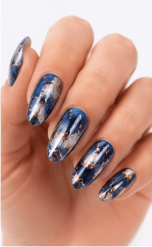 Foil nails use thin metallic or colored foil pieces to add shine, texture, and an irregular luxury effect to the manicure. The foil can be pressed lightly for scattered accents, layered under sheer gel for a soft glow, or placed boldly over dark colors for a dramatic editorial look. This style is popular because it gives every set a handcrafted, premium feeling without requiring complex hand painting. Gold foil feels elegant and bridal, silver foil looks modern, while holographic or colored foil creates a playful fashion mood. It works well for salon galleries, seasonal collections, and clients who want detail with minimal effort.