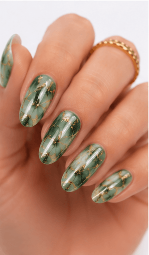 Foil nails use thin metallic or colored foil pieces to add shine, texture, and an irregular luxury effect to the manicure. The foil can be pressed lightly for scattered accents, layered under sheer gel for a soft glow, or placed boldly over dark colors for a dramatic editorial look. This style is popular because it gives every set a handcrafted, premium feeling without requiring complex hand painting. Gold foil feels elegant and bridal, silver foil looks modern, while holographic or colored foil creates a playful fashion mood. It works well for salon galleries, seasonal collections, and clients who want detail with minimal effort.