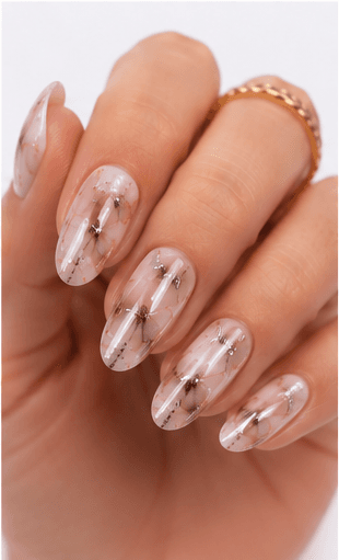 Foil nails use thin metallic or colored foil pieces to add shine, texture, and an irregular luxury effect to the manicure. The foil can be pressed lightly for scattered accents, layered under sheer gel for a soft glow, or placed boldly over dark colors for a dramatic editorial look. This style is popular because it gives every set a handcrafted, premium feeling without requiring complex hand painting. Gold foil feels elegant and bridal, silver foil looks modern, while holographic or colored foil creates a playful fashion mood. It works well for salon galleries, seasonal collections, and clients who want detail with minimal effort.