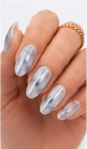 Foil nails use thin metallic or colored foil pieces to add shine, texture, and an irregular luxury effect to the manicure. The foil can be pressed lightly for scattered accents, layered under sheer gel for a soft glow, or placed boldly over dark colors for a dramatic editorial look. This style is popular because it gives every set a handcrafted, premium feeling without requiring complex hand painting. Gold foil feels elegant and bridal, silver foil looks modern, while holographic or colored foil creates a playful fashion mood. It works well for salon galleries, seasonal collections, and clients who want detail with minimal effort.