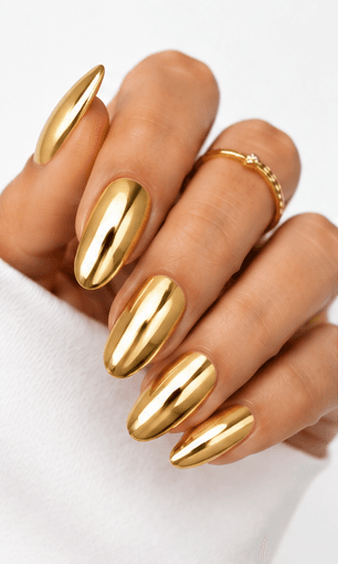 Mirror nails are known for their polished metallic reflection, creating a sleek, futuristic look that instantly catches the light. This style is often made with chrome powder or reflective gel layered over a smooth base color, giving the nails a glassy, high-shine finish. It works beautifully for minimalist fashion, luxury beauty shoots, party looks, and editorial nail collections. Depending on the base shade, mirror nails can feel cool and modern, glamorous and bold, or soft and elegant. They are especially popular among clients who want a statement manicure without heavy patterns or complicated art.