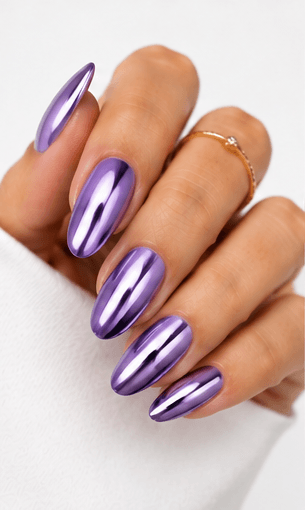 Mirror nails are known for their polished metallic reflection, creating a sleek, futuristic look that instantly catches the light. This style is often made with chrome powder or reflective gel layered over a smooth base color, giving the nails a glassy, high-shine finish. It works beautifully for minimalist fashion, luxury beauty shoots, party looks, and editorial nail collections. Depending on the base shade, mirror nails can feel cool and modern, glamorous and bold, or soft and elegant. They are especially popular among clients who want a statement manicure without heavy patterns or complicated art.
