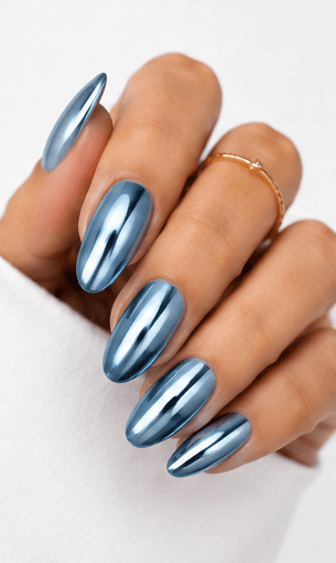 Mirror nails are known for their polished metallic reflection, creating a sleek, futuristic look that instantly catches the light. This style is often made with chrome powder or reflective gel layered over a smooth base color, giving the nails a glassy, high-shine finish. It works beautifully for minimalist fashion, luxury beauty shoots, party looks, and editorial nail collections. Depending on the base shade, mirror nails can feel cool and modern, glamorous and bold, or soft and elegant. They are especially popular among clients who want a statement manicure without heavy patterns or complicated art.