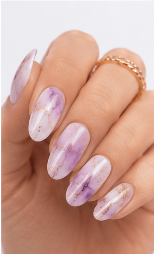Watercolor nails are inspired by the soft transparency and flowing pigments of watercolor painting. This style uses diluted gel colors, sheer washes, and blended edges to create an artistic, airy look on the nails. It can feel romantic with florals, modern with abstract color clouds, or fresh with pastel gradients. Watercolor nails are especially useful for clients who want a delicate design that still feels creative and personal. Because the effect is light and layered, it photographs beautifully for beauty editorials, spring collections, bridal nail sets, and soft lifestyle content.