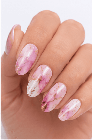 Watercolor nails are inspired by the soft transparency and flowing pigments of watercolor painting. This style uses diluted gel colors, sheer washes, and blended edges to create an artistic, airy look on the nails. It can feel romantic with florals, modern with abstract color clouds, or fresh with pastel gradients. Watercolor nails are especially useful for clients who want a delicate design that still feels creative and personal. Because the effect is light and layered, it photographs beautifully for beauty editorials, spring collections, bridal nail sets, and soft lifestyle content.